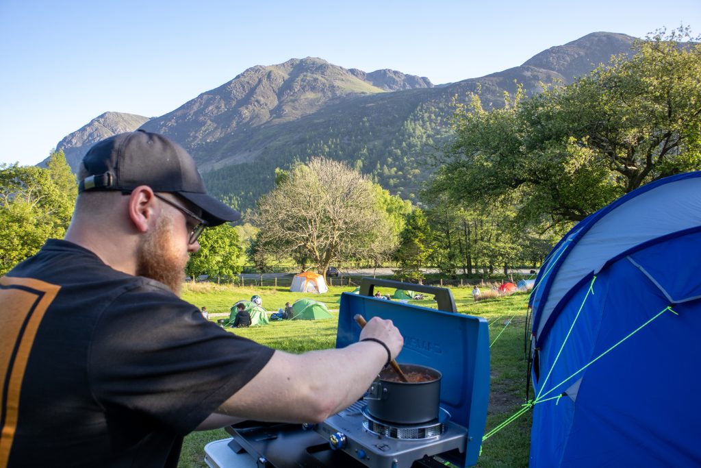 Adam cooking besides our camping pitch in Buttermere
